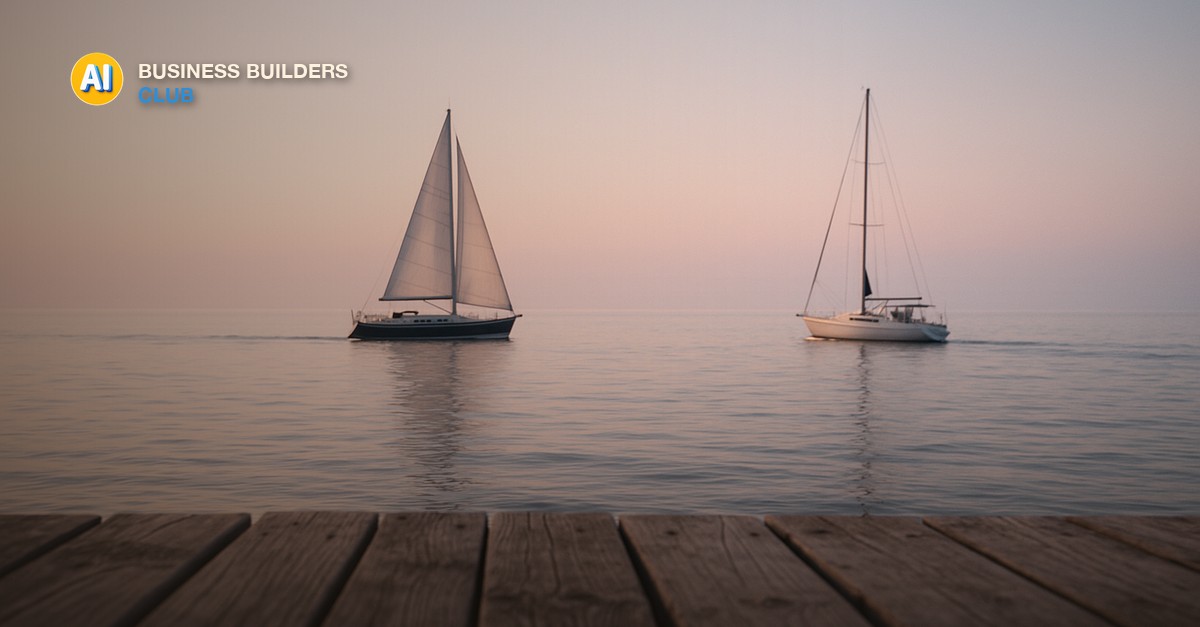 Two sailboats on calm open water at sunset, one under full white sail and one motoring steadily forward, viewed from a weathered wooden dock