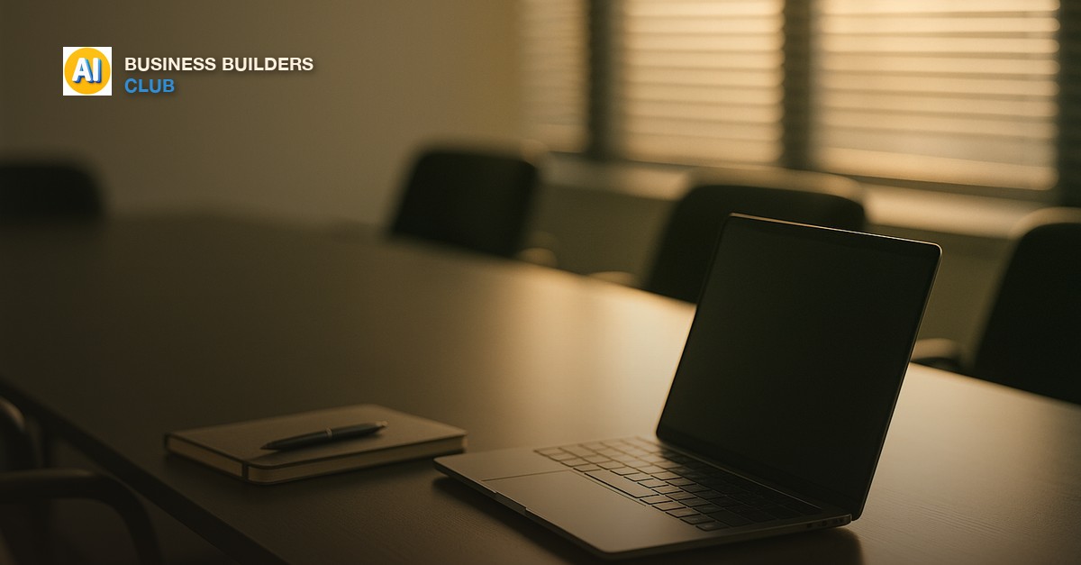 Laptop and notebook on a conference table with soft morning light