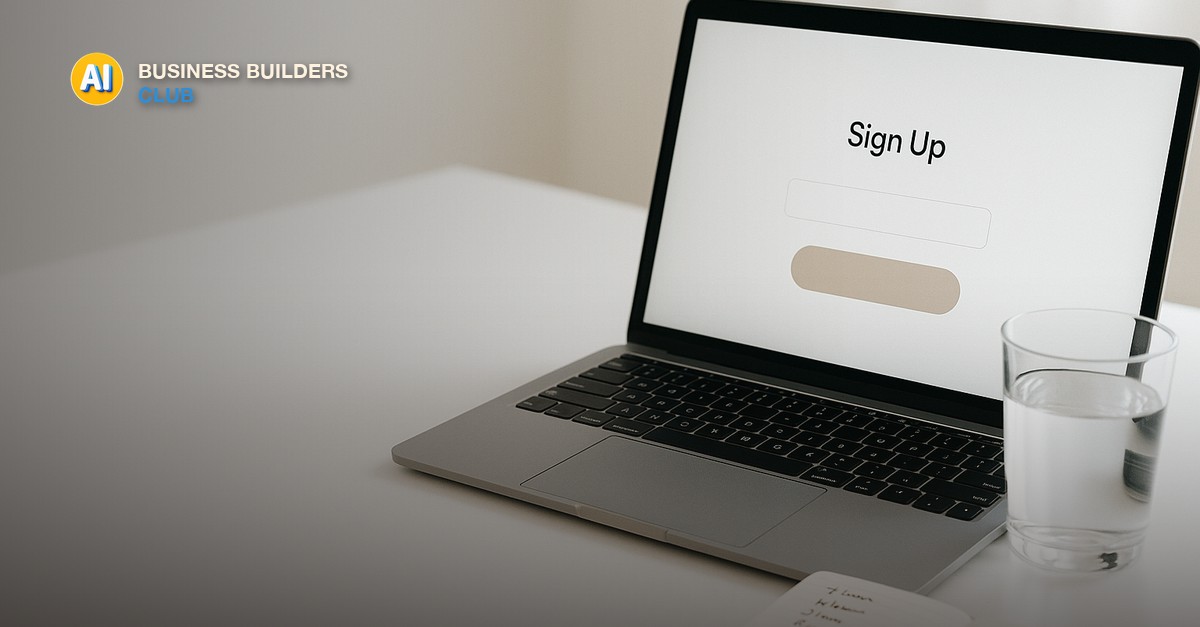 A laptop showing a clean single-column signup page with one email field and a button, beside a notebook listing names and a cup of coffee on a bright desk - AI Tools and Training Club
