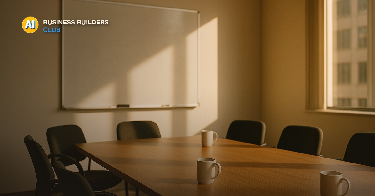 An empty meeting room in warm morning light with a clean whiteboard, wooden table and chairs, no people